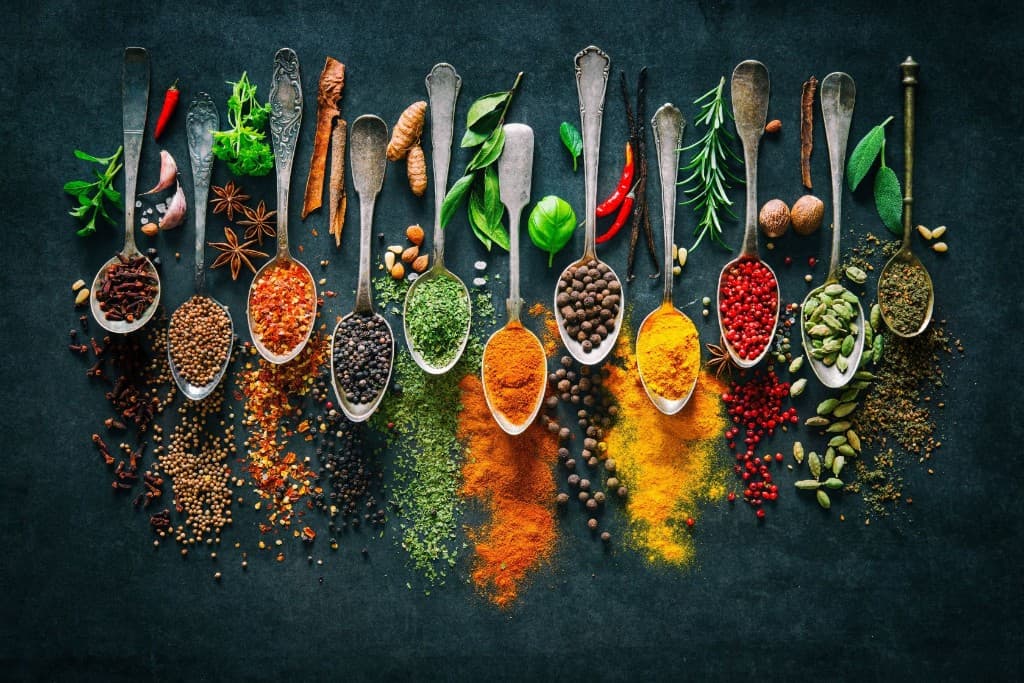 Multi-flavor design with premium spices and herbs arranged for REAL flavor crafting